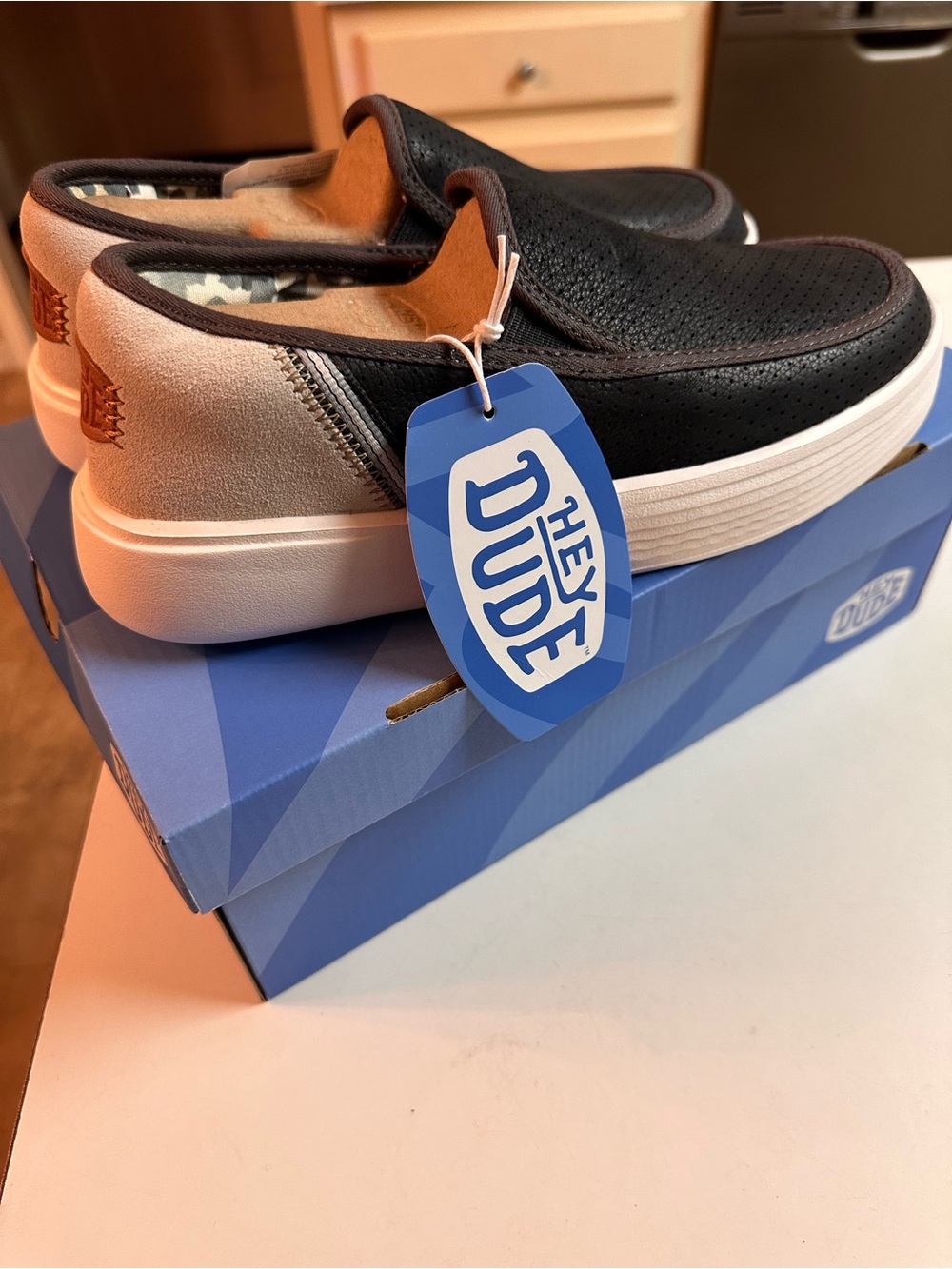 Hey Dude Sunapee Slip-On Sneakers in Black and Tan W7